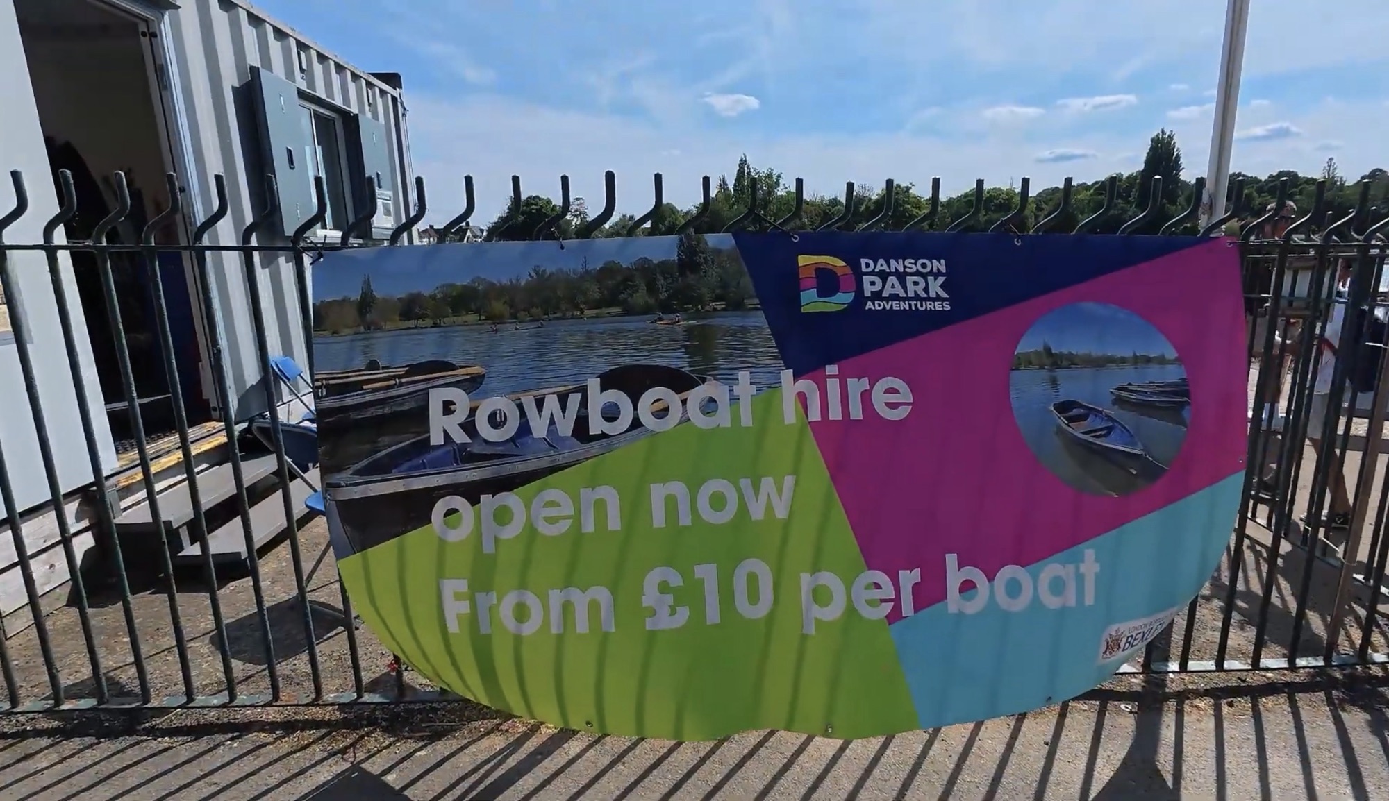 Rowboat hire banner at the Danson Park Adventures jetty advertising boats from £10