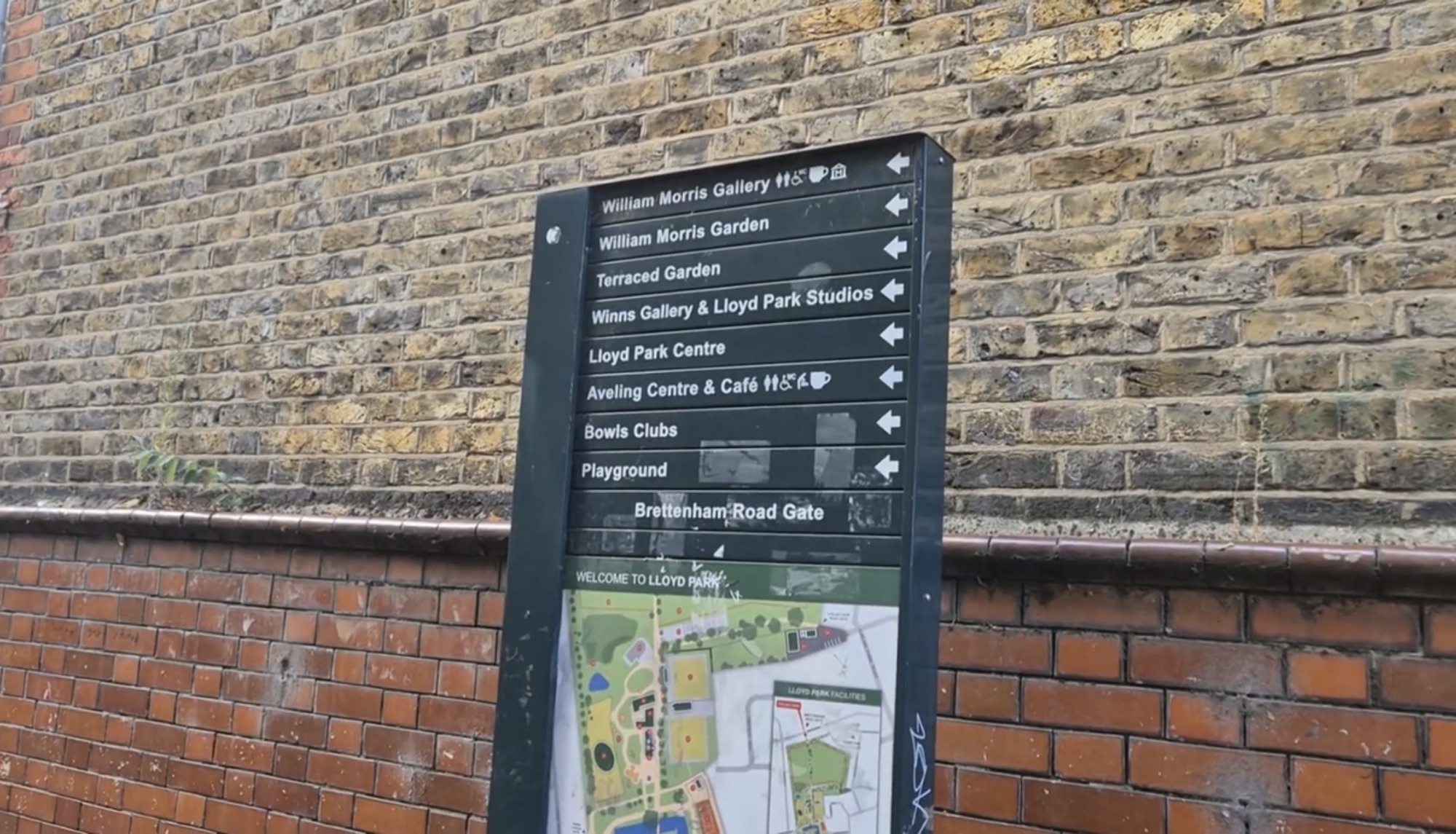 Lloyd Park wayfinding sign listing the Gallery, gardens, Winns Gallery, Aveling Centre and playground