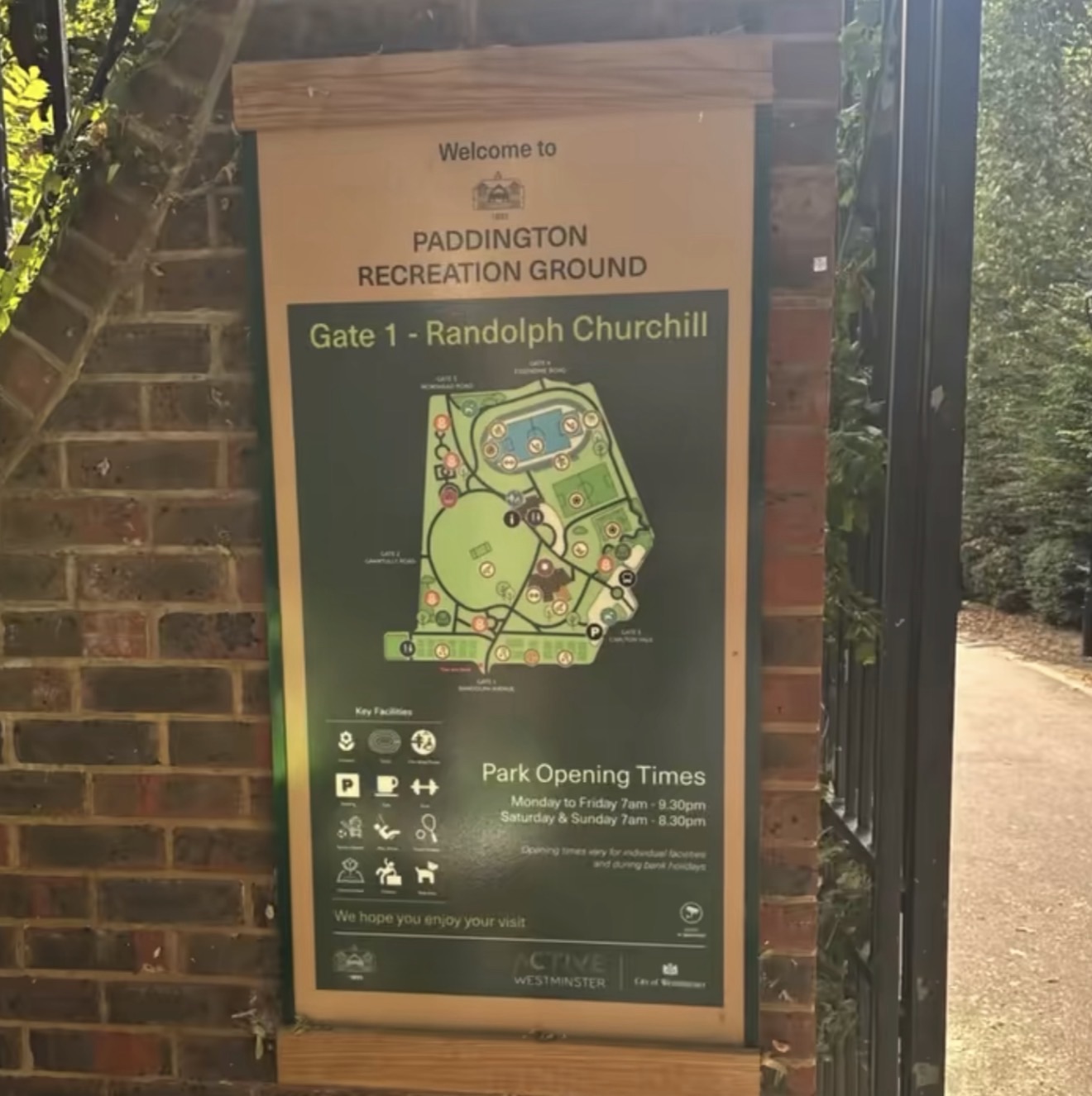 Gate 1 Randolph Churchill entrance sign and park map at Paddington Recreation Ground