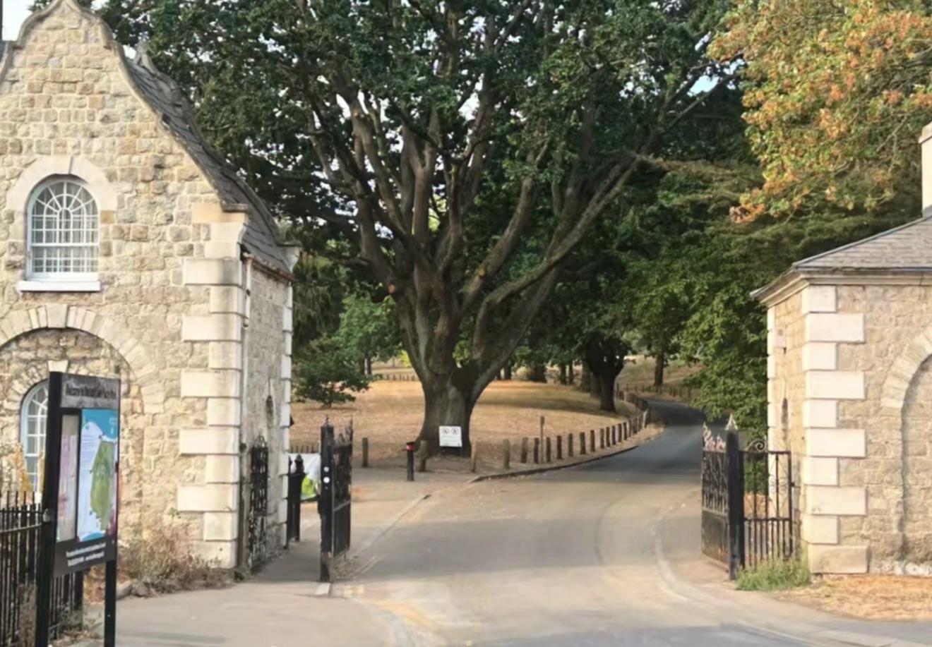 Georgian stone gatehouses and tree-lined entrance road at Beckenham Place Park