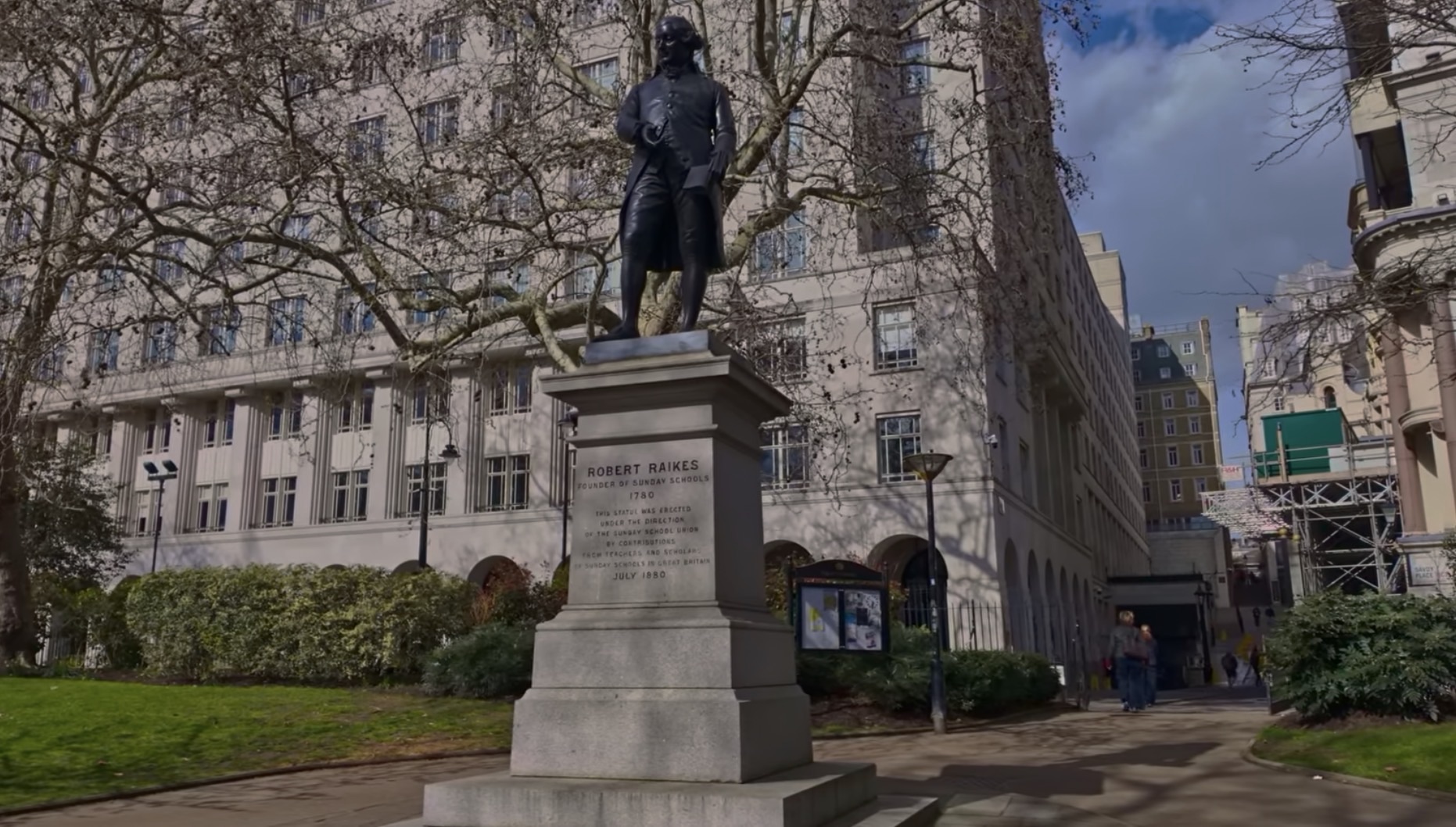 Statue of Robert Raikes, founder of Sunday Schools, on the Embankment wall facing the river