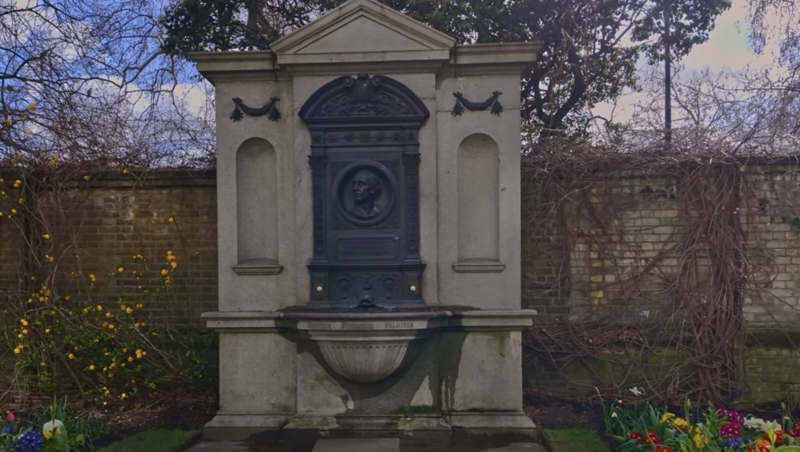The full Henry Fawcett memorial fountain structure with garlands and the inscription Feliciter