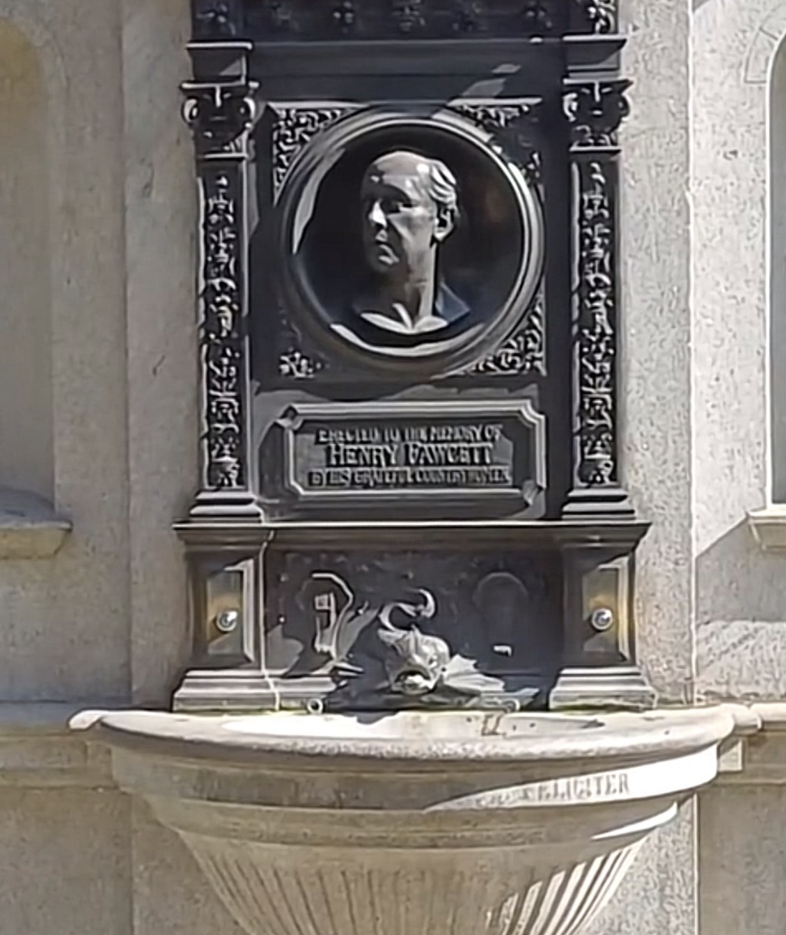 Close-up bronze medallion of Henry Fawcett on his memorial fountain