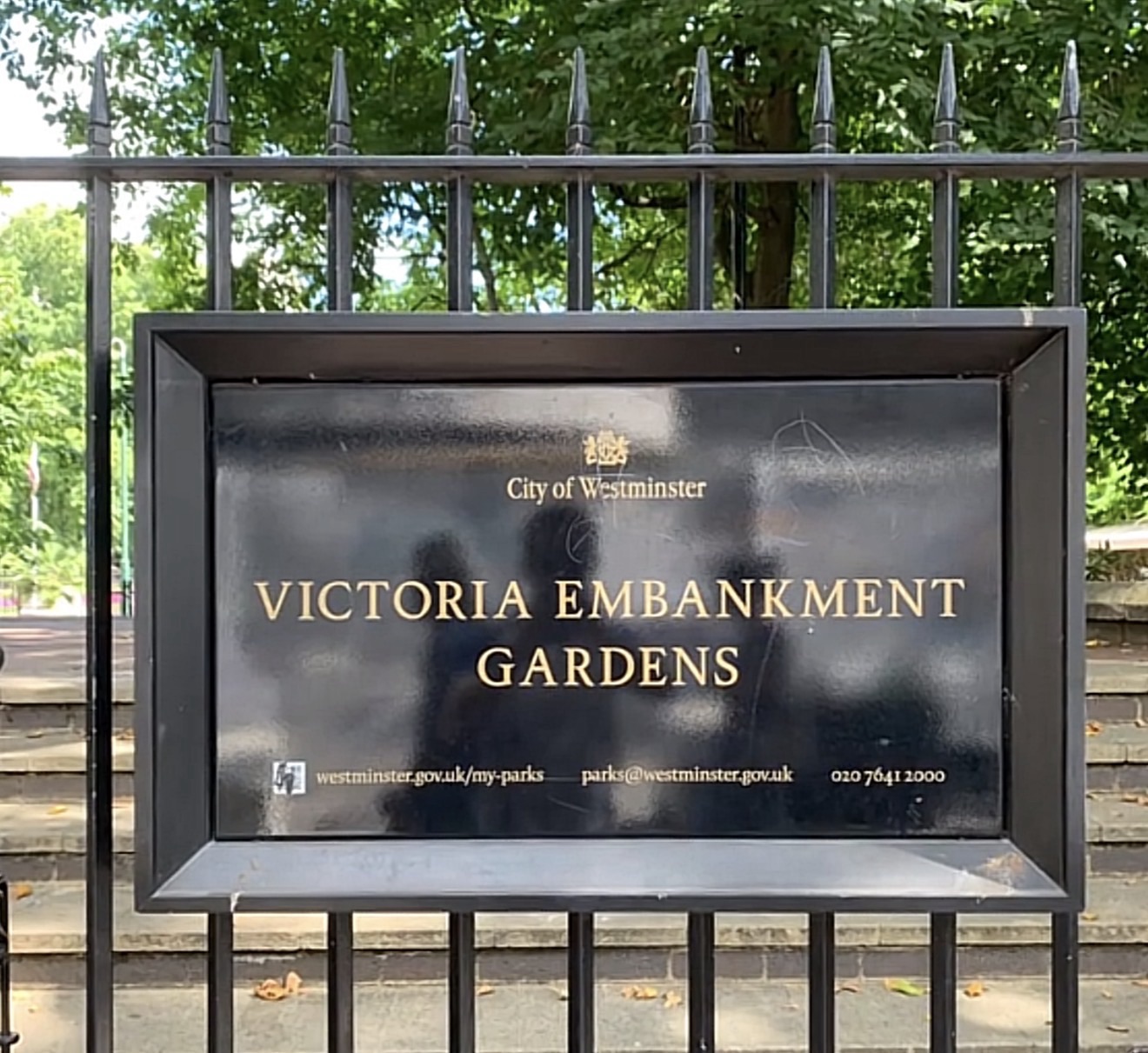 City of Westminster Victoria Embankment Gardens sign on the railings near Savoy Place