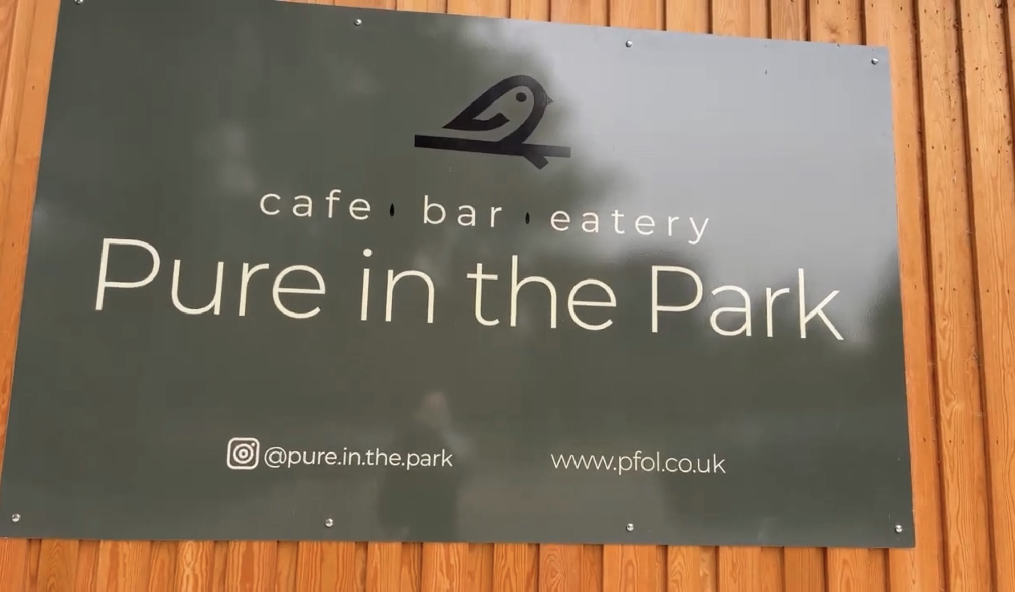 Pure in the Park cafe bar and eatery sign in Gunnersbury Park
