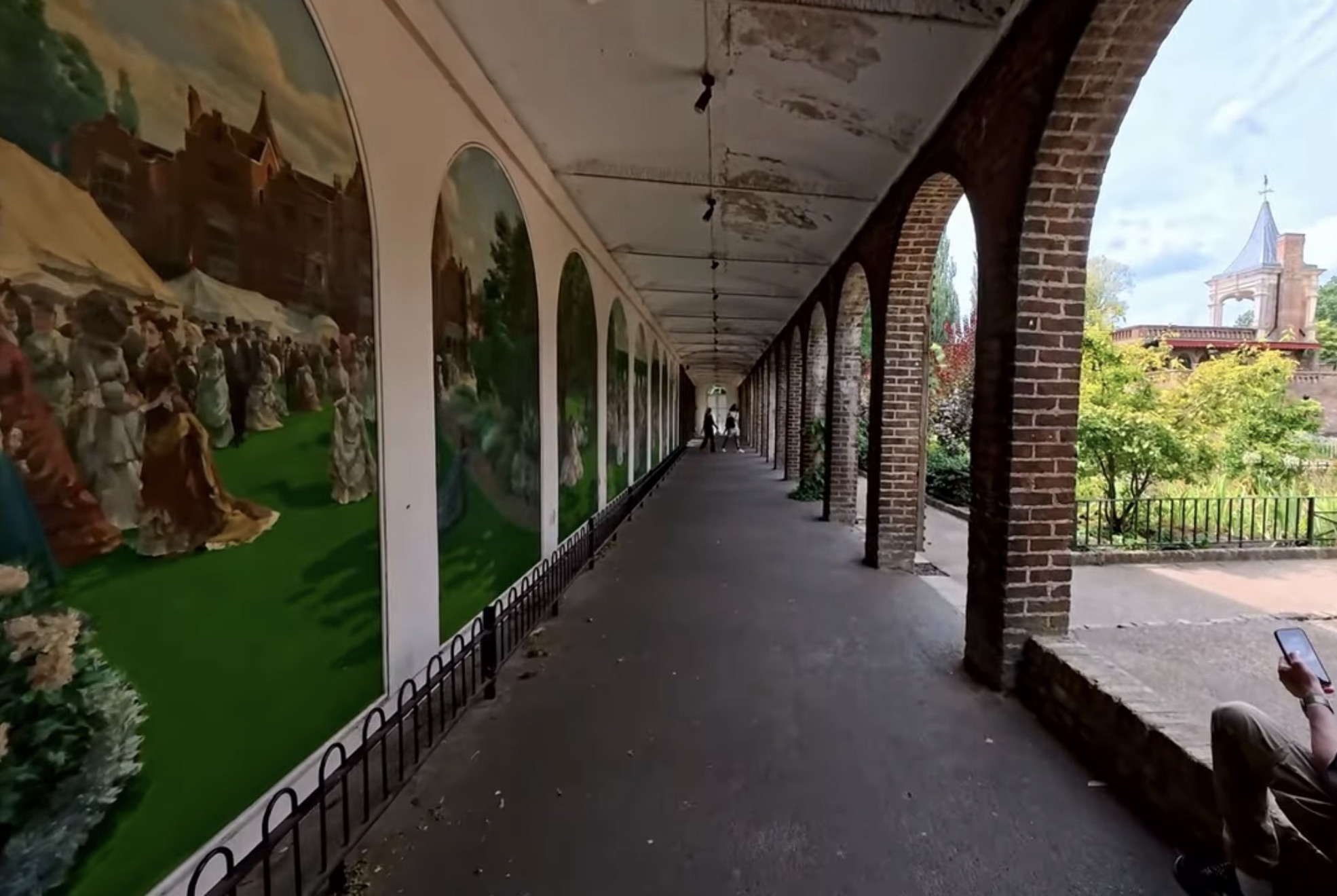 Covered arcade with painted mural panels of Victorian garden scenes at Holland Park
