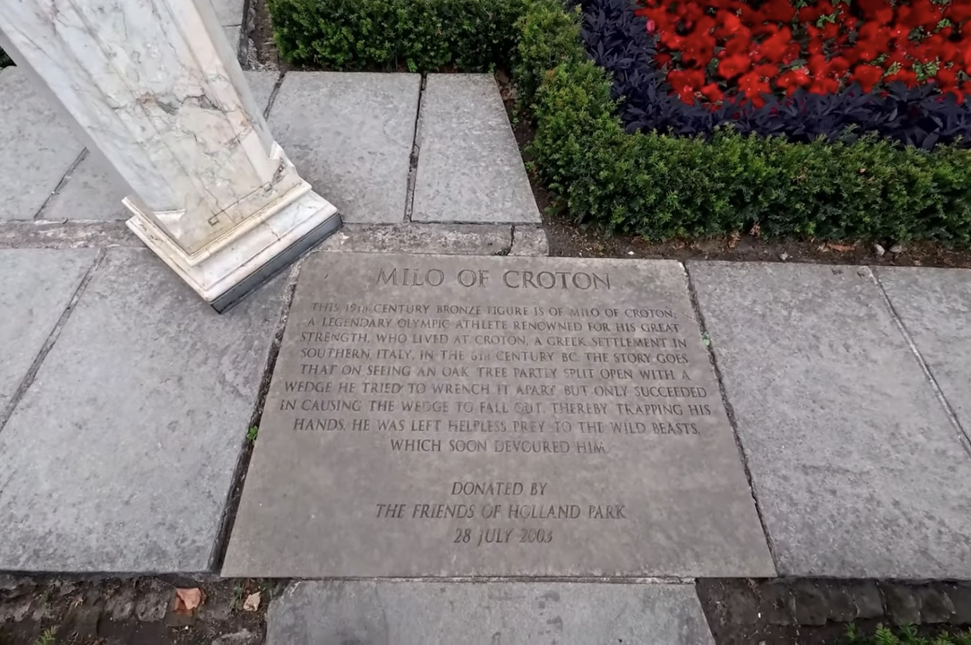 Milo of Croton plaque telling the story of the legendary Greek Olympic athlete