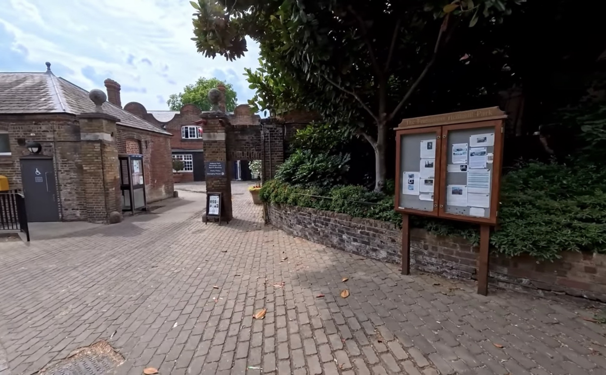 Friends of Holland Park community notice board near the old stable courtyard