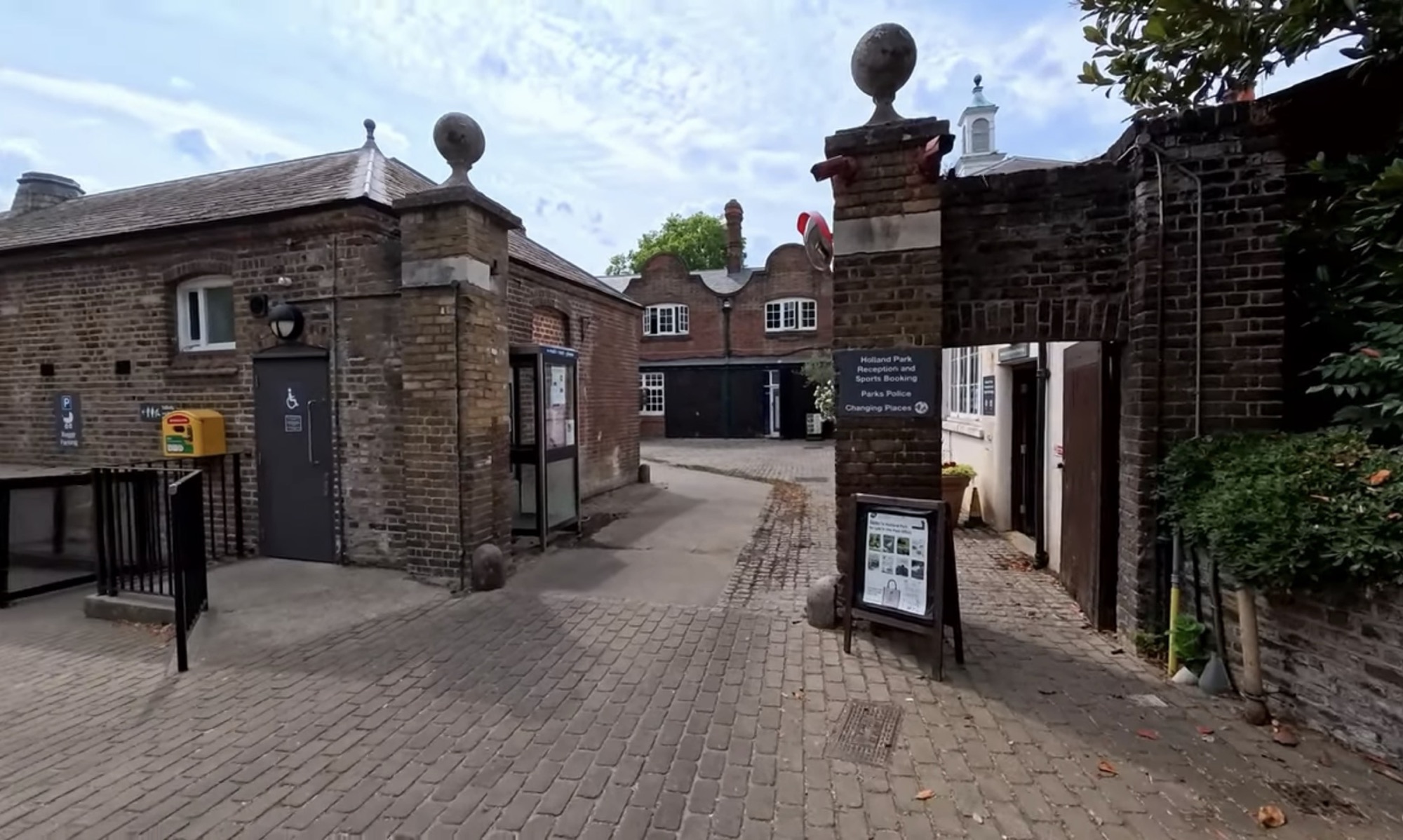 Cobbled courtyard at the Holland Park reception and sports booking office