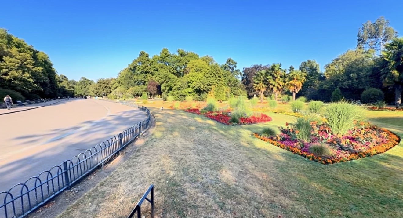 Colourful summer flower beds along a path in Victoria Park
