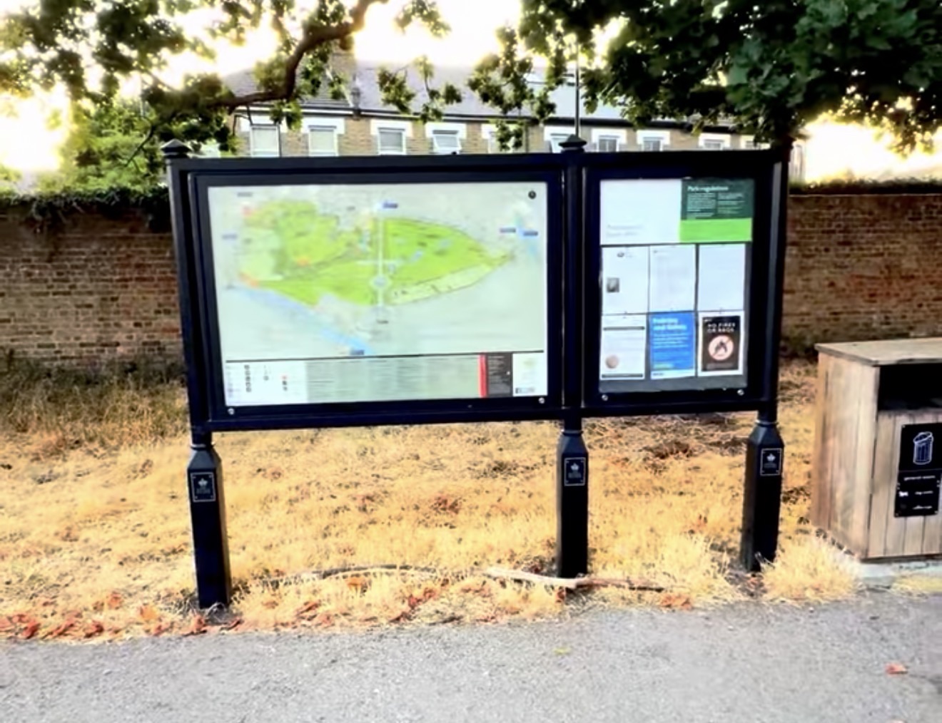 Double notice board at Bushy Park showing a park map and posted regulations
