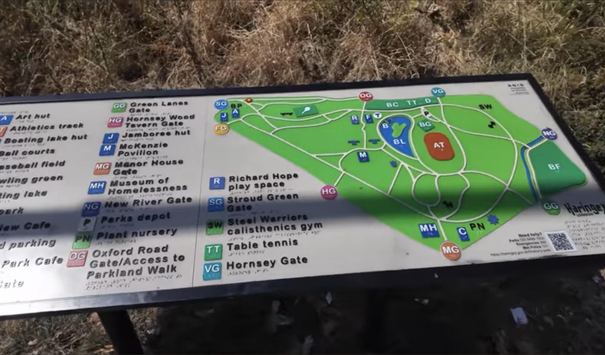 Tactile map board detail showing gates, the boating lake and athletics track in Finsbury Park