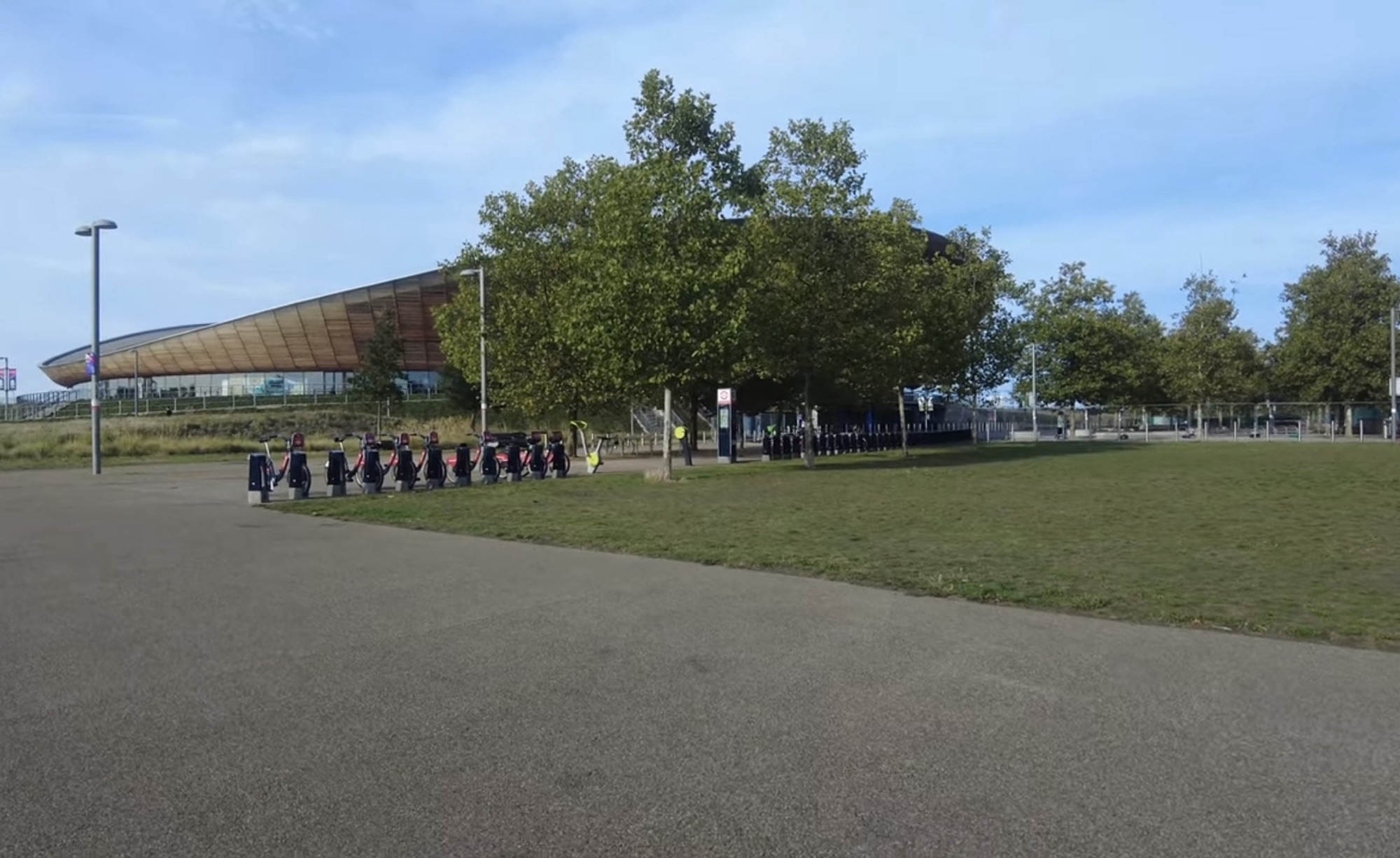 Santander Cycles hire docking station beside the Lee Valley VeloPark velodrome building in Queen Elizabeth Olympic Park