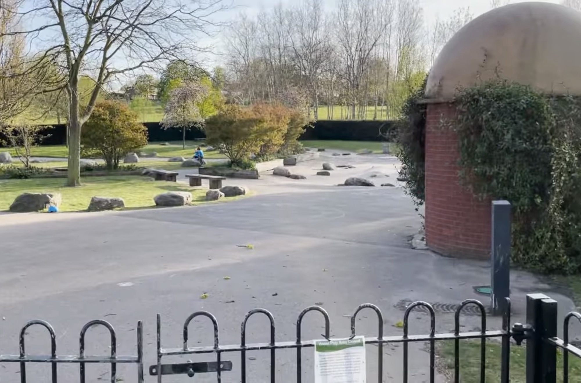 Sand and water play area with rocks and stepping stones at the children's playground in Brockwell Park