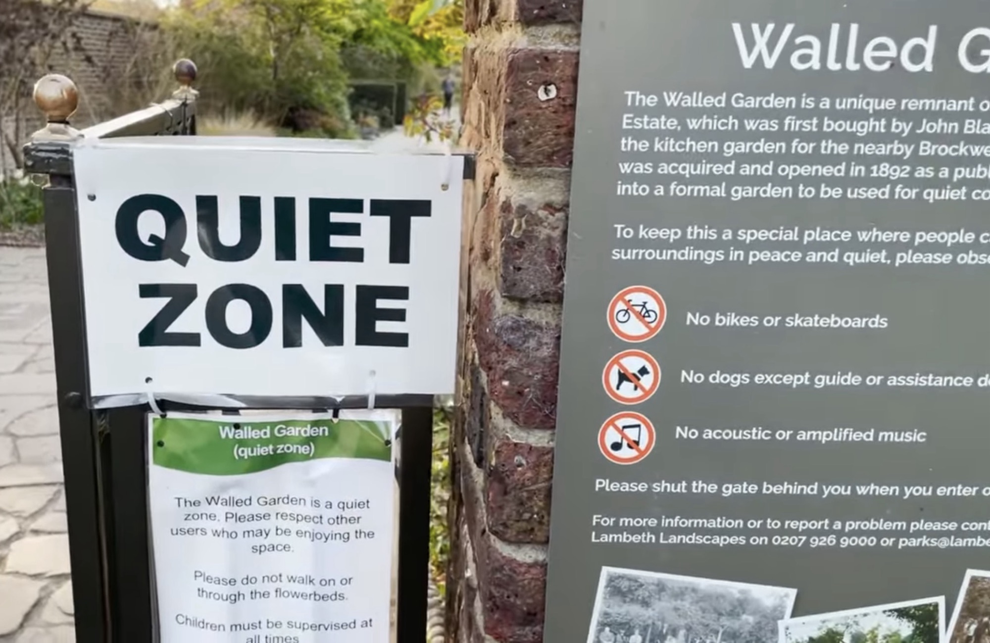 Quiet Zone sign at the entrance to the Walled Garden at Brockwell Park beside the history information board
