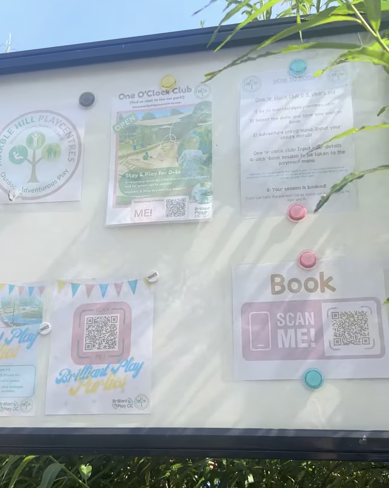 Booking noticeboard with a QR code for the One O'Clock Club and Brilliant Play parties at Marble Hill