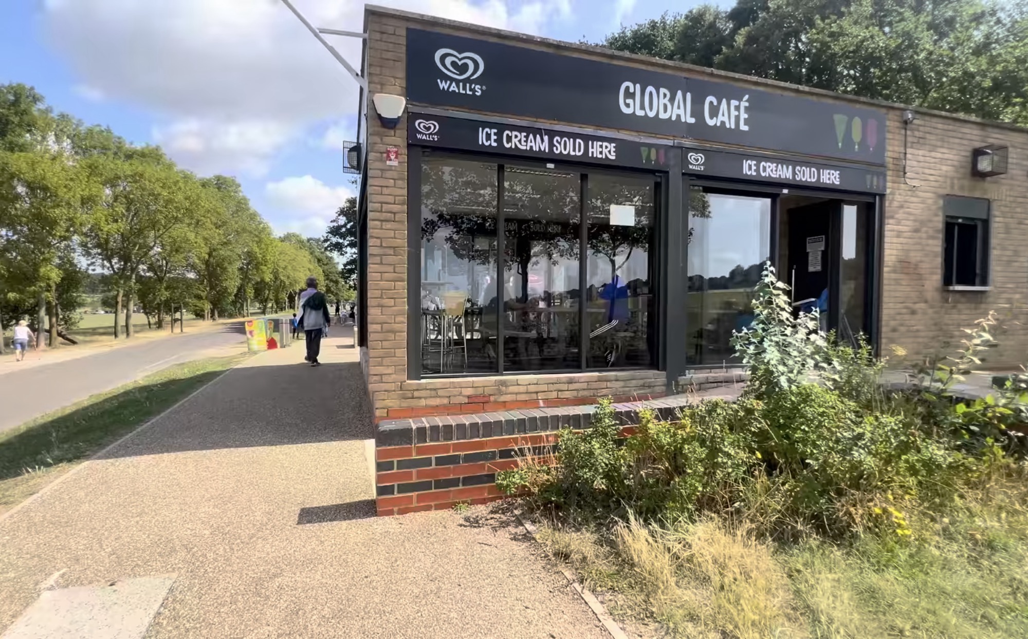 Global Café kiosk with ice cream signs beside a path at Hainault Forest Country Park