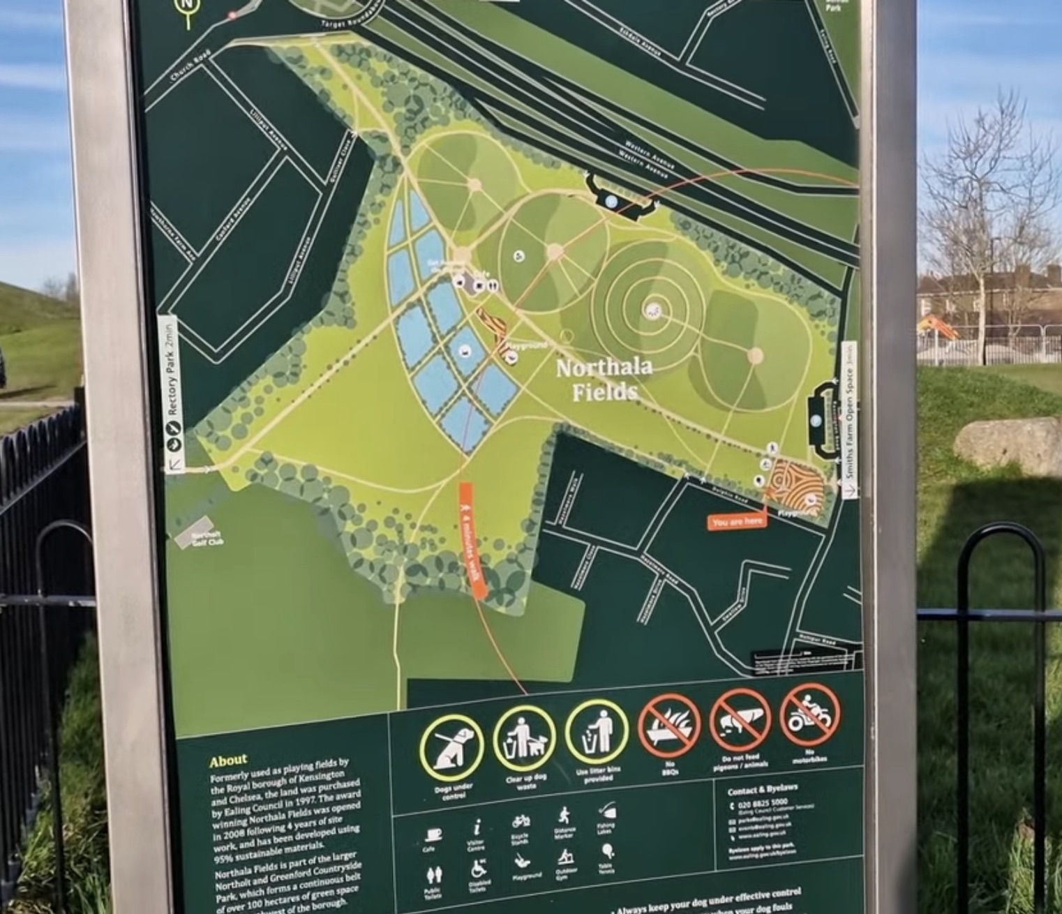 Park map and information sign for Northala Fields showing facilities, byelaws and the layout of the park