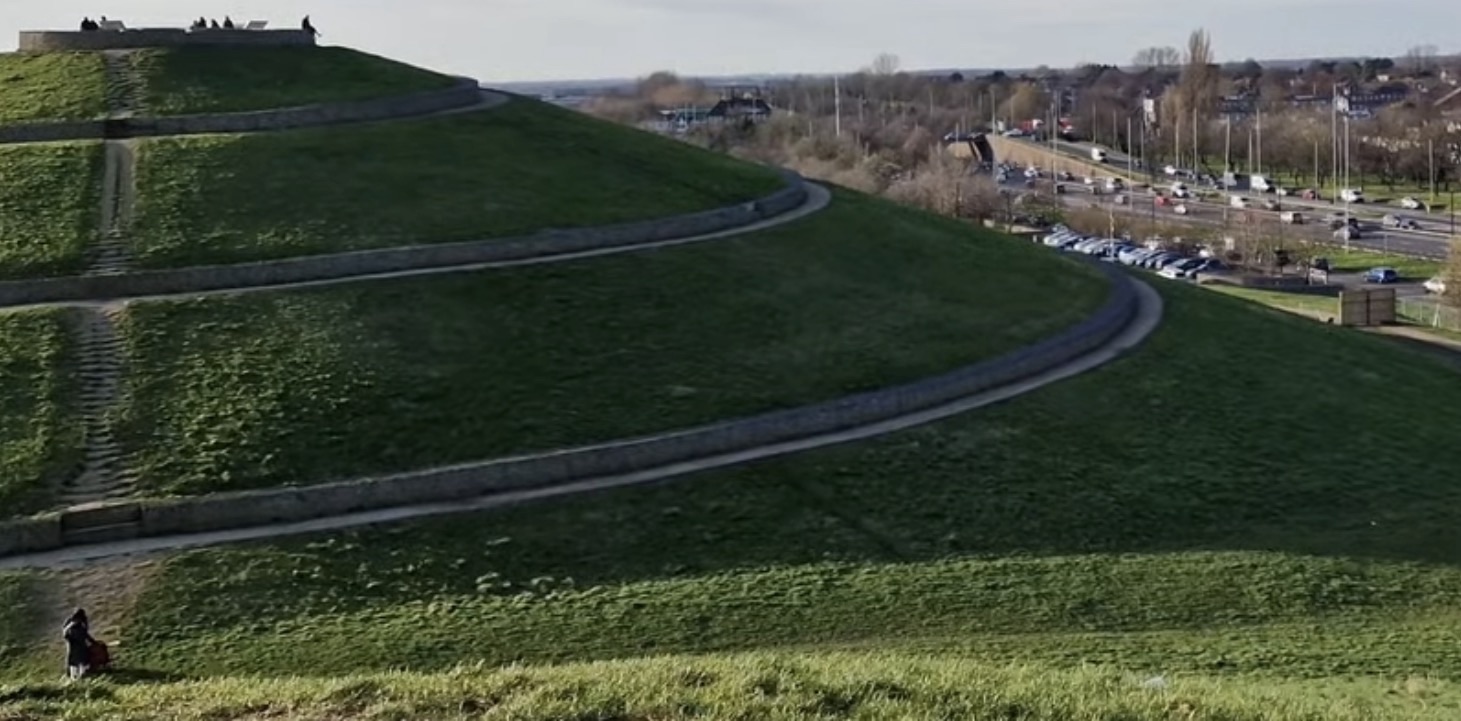 Spiral path winding around the mound with the A40 and car park below at Northala Fields