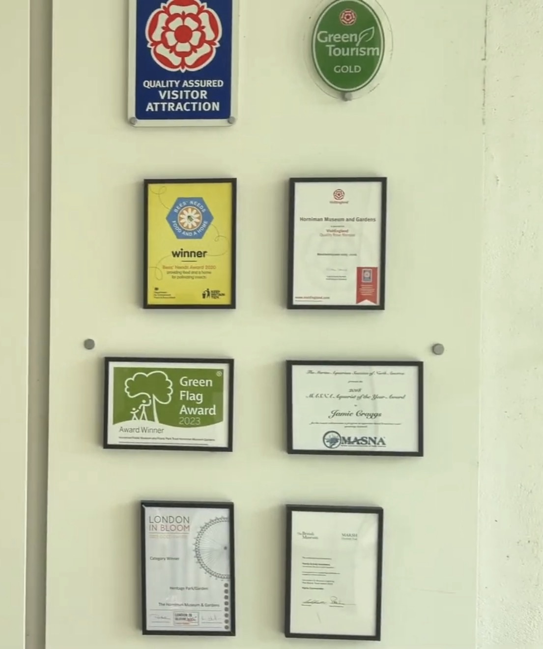 Wall of awards at the Horniman including Green Flag Award 2023, Green Tourism Gold and London in Bloom
