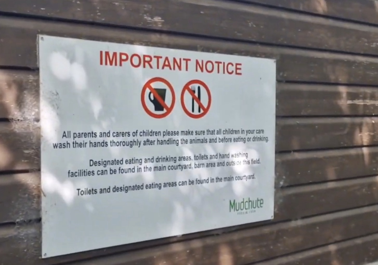 Hand-washing notice and sink at Mudchute Park and Farm for visitors after touching animals