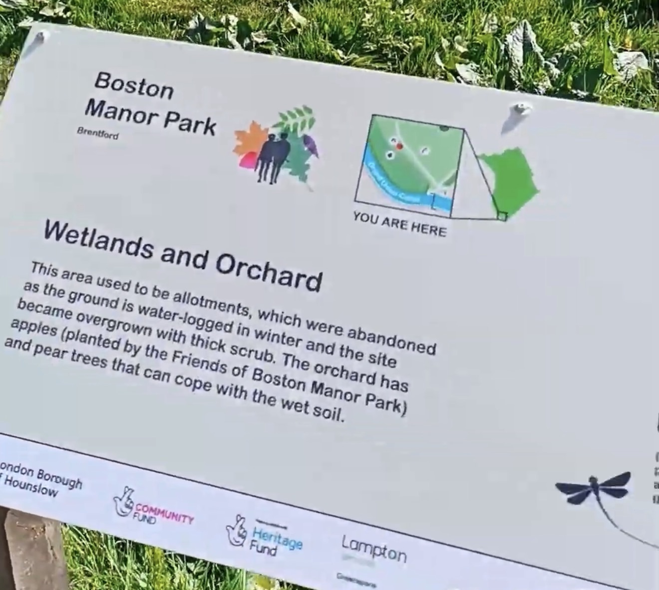 Boston Manor Park sign titled Wetlands and Orchard with a you-are-here map